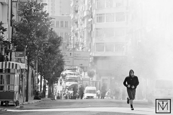 Guy Running in Gas Mask