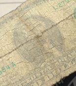 A dollar bill, very faded