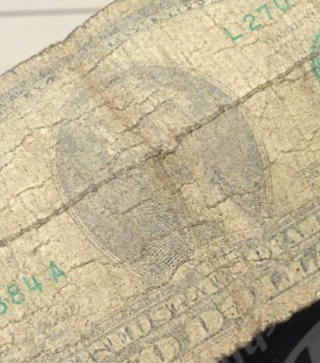 A dollar bill, very faded