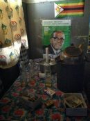 A picture of a hostel interior with Mugabe poster, Mbare, ZImbabwe