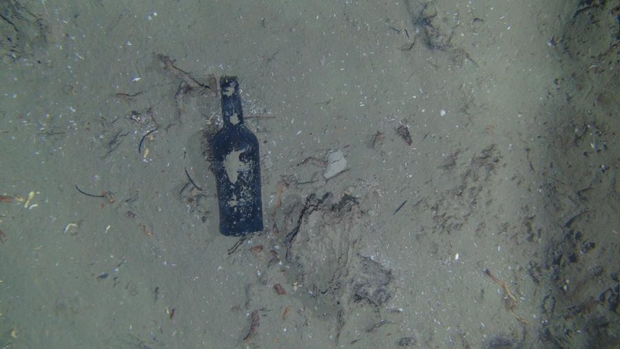 glass bottle in shipwreck by WHOI