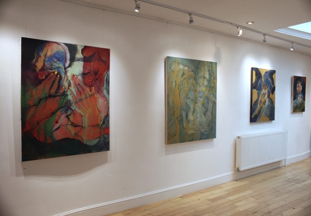 paintings hanging on walls
