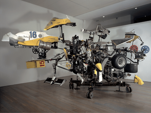 Jean Tinguely Pit-Stop,1984 Formula 1 auto parts, scrap iron, 4 x 16 mm film projectors; 360 x 600 x 600 cm © Museum Tinguely, Basel Jean Tinguely © SIAE, 2024 Photo Christian Baur