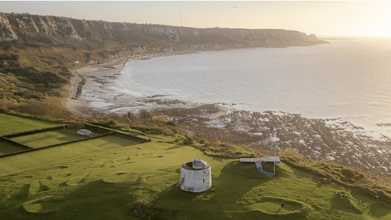 Image shows aerial view of Folkestone town and beach.