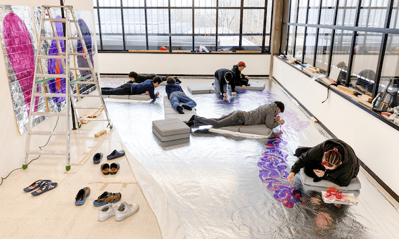 Images shows artists working on floor image AdE Vela Rapido by Edipo Re