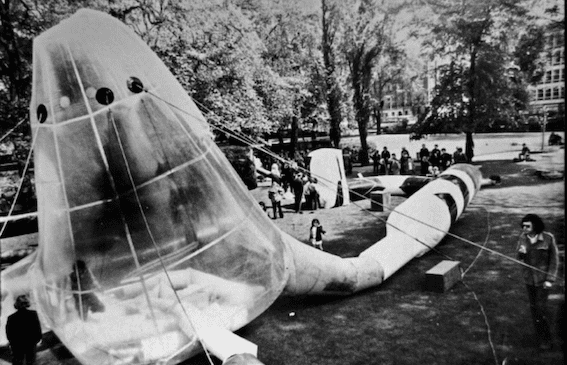 Image shows black and white photograph of inflatable installation in Kensington Gardens, late 70s. Action Space Archive