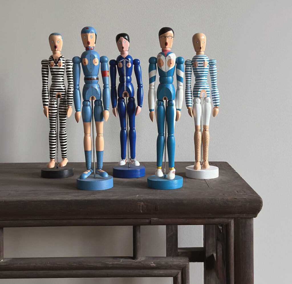 Chen Fei, We are Wooden Dolls series, Mixed Media. Each 30.4 x Ø 8 cm base 2007-09. Courtesy of the artist and Schoeni Projects.