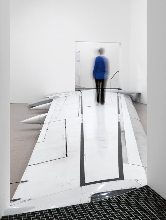 do not walk outside this area, 2012 Boeing 737-500 wing, dividing walls with doorways, two staircases Overall dimensions 152 x 641 x 1380 cm Installation view at Deutsche Guggenheim, Berlin Adrastus Collection, Arévalo Photo © Jens Ziehe